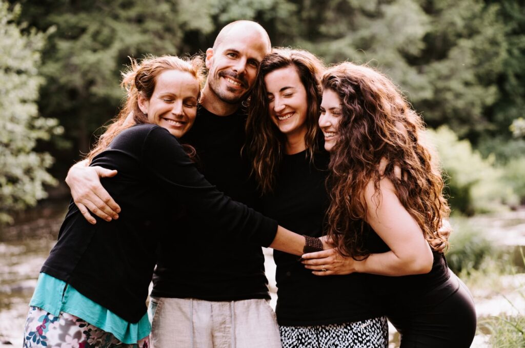 Four people hugging